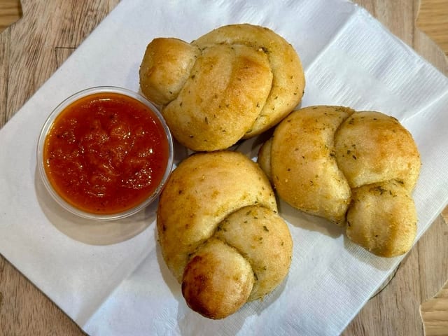 Three Garlic Knots with Marinara Dip.